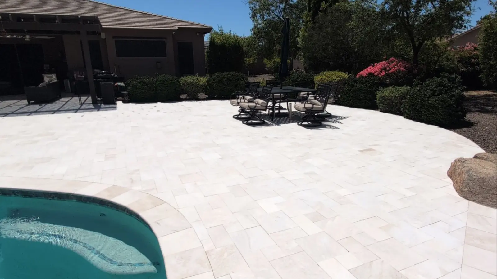 Clean travertine patio and pool area in Litchfield Park