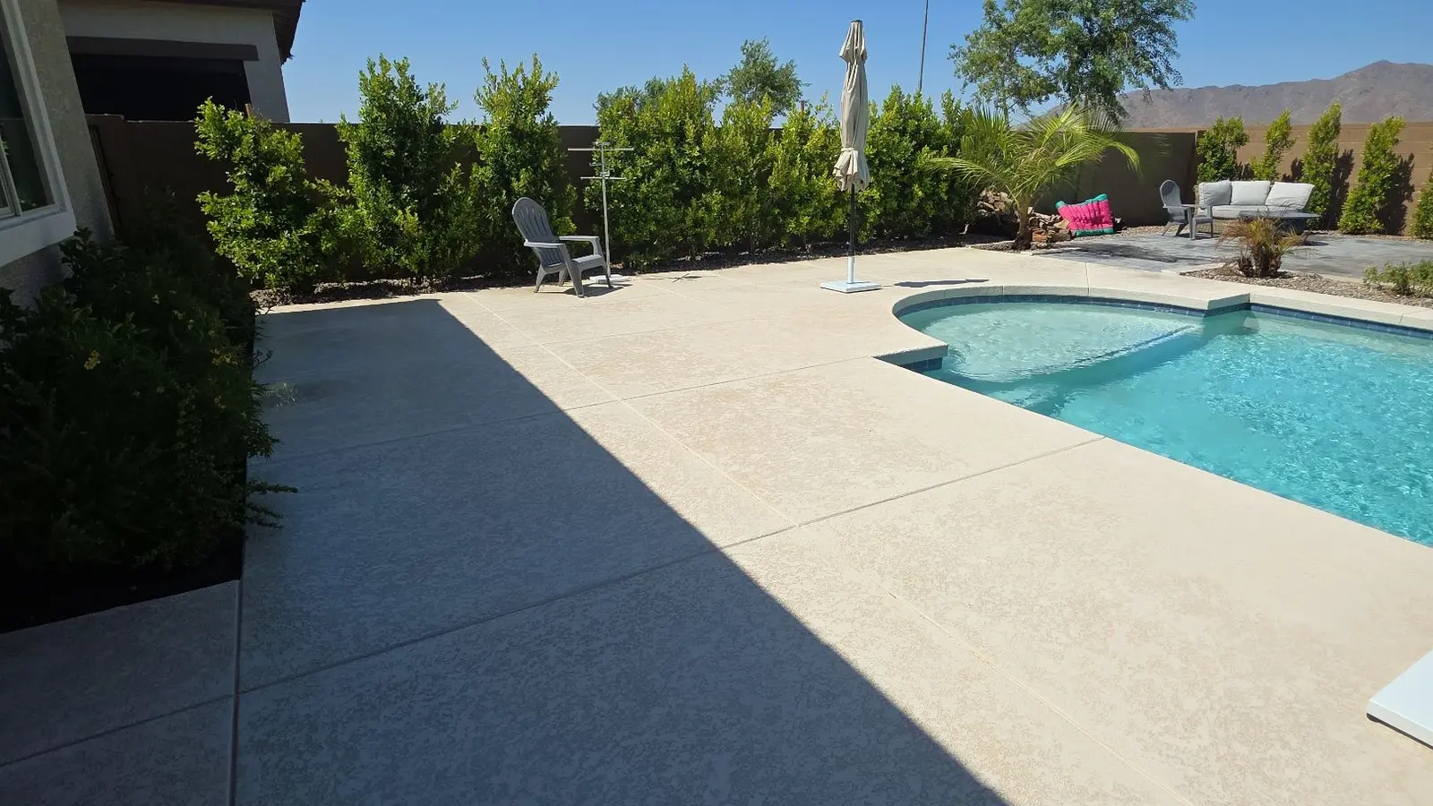 Clean patio and pool deck at a completed Waddell residential project