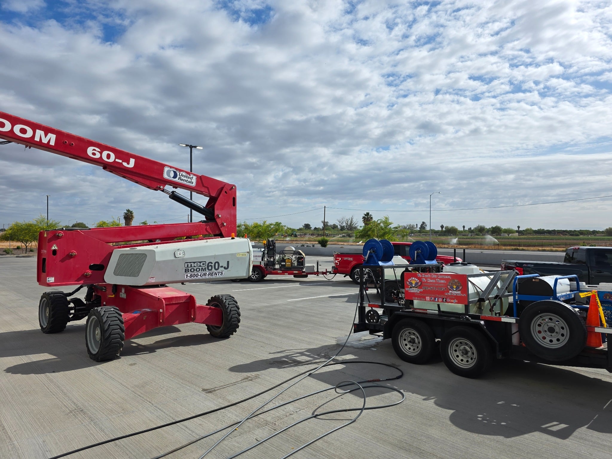 Patriot Power Washing equipment and lift staged for tilt-up construction cleaning at the PCA project